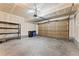 Spacious two-car garage with ample lighting, a garage door, and shelving for storage at 10044 Martin Luther King Blvd, Denver, CO 80238