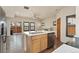Well-appointed kitchen with an island, stainless steel dishwasher, and open floor plan at 10044 Martin Luther King Blvd, Denver, CO 80238