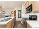 Modern kitchen featuring granite countertops, stainless steel appliances, and bar seating at 10044 Martin Luther King Blvd, Denver, CO 80238