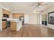 Bright open kitchen featuring an island, stainless steel appliances, and hardwood floors at 10044 Martin Luther King Blvd, Denver, CO 80238