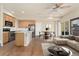 Open-concept living space with hardwood floors, modern lighting, and stainless steel appliances at 10044 Martin Luther King Blvd, Denver, CO 80238