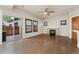 Inviting living room with access to a patio, hardwood floors, and a stone fireplace at 10044 Martin Luther King Blvd, Denver, CO 80238