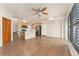 Inviting open floor plan featuring hardwood floors, kitchen island, and natural light at 10044 Martin Luther King Blvd, Denver, CO 80238
