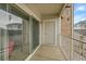Balcony featuring a sliding glass door with exterior door and railing at 15700 E Jamison Dr # 6-201, Englewood, CO 80112