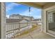 Balcony with a view of exterior townhomes and landscaping at 15700 E Jamison Dr # 6-201, Englewood, CO 80112