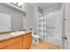 Bathroom featuring a shower with curtain, toilet, sink and wood-look flooring at 15700 E Jamison Dr # 6-201, Englewood, CO 80112