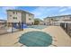 A community pool, covered for the off-season, surrounded by residences and fencing at 15700 E Jamison Dr # 6-201, Englewood, CO 80112