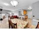 Open concept dining room with view of kitchen and living room, great for entertaining guests at 15700 E Jamison Dr # 6-201, Englewood, CO 80112