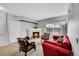 Comfortable living room boasts a fireplace and sliding glass door for natural light at 15700 E Jamison Dr # 6-201, Englewood, CO 80112