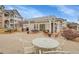 A furnished outdoor lounge with grill, tables, and chairs offers residents a relaxing space to gather at 15700 E Jamison Dr # 6-201, Englewood, CO 80112