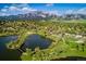 Scenic aerial view of a lake near mountains, playgrounds, and green spaces at 1275 Berea Dr, Boulder, CO 80305