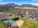 Breathtaking aerial view of a neighborhood near mountains, a lake, sports, and the recreation center at 1275 Berea Dr, Boulder, CO 80305