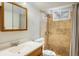 Updated bathroom with a tiled shower, modern vanity, and a window providing natural light at 1275 Berea Dr, Boulder, CO 80305