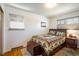 Inviting bedroom with a cozy quilt and natural light from two windows at 1275 Berea Dr, Boulder, CO 80305