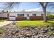 Charming single-story home with a well-kept lawn and rock garden at 1275 Berea Dr, Boulder, CO 80305