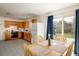 Eat-in kitchen with wooden cabinets and sliding doors to the backyard at 1275 Berea Dr, Boulder, CO 80305