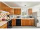 Functional kitchen with wooden cabinets and essential appliances at 1275 Berea Dr, Boulder, CO 80305