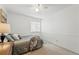 Cozy bedroom featuring wainscoting and a plush throw blanket atop the neatly made bed at 2574 Cove Creek Ct, Highlands Ranch, CO 80129