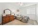 Comfortable bedroom with neutral carpet, and a classic wooden dresser at 2574 Cove Creek Ct, Highlands Ranch, CO 80129