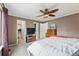 Spacious bedroom with carpet, ceiling fan, and access to a walk-in closet at 2574 Cove Creek Ct, Highlands Ranch, CO 80129