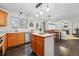 Open concept kitchen and dining area with sliding glass doors, wood floors, and backyard views at 2574 Cove Creek Ct, Highlands Ranch, CO 80129