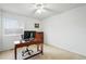 Bright office space featuring a ceiling fan, and a workspace in front of the window at 2574 Cove Creek Ct, Highlands Ranch, CO 80129