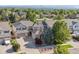 This is an aerial view of a lovely two-story home showcasing its landscaped yard and neighborhood at 9636 W 71St Pl, Arvada, CO 80004