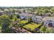 Aerial view of the neighborhood showcasing well-manicured lawns, mature trees, and the surrounding residential area at 9636 W 71St Pl, Arvada, CO 80004