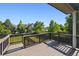 Wooden back deck overlooking green backyard at 9636 W 71St Pl, Arvada, CO 80004