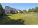 Expansive backyard with lush green grass and a sturdy wooden fence, perfect for outdoor activities and privacy at 9636 W 71St Pl, Arvada, CO 80004