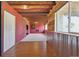 Basement with red paneling, and carpeted area at 9636 W 71St Pl, Arvada, CO 80004