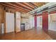 Finished basement with wooden-themed bar area at 9636 W 71St Pl, Arvada, CO 80004