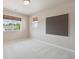 Bright bedroom with large window and neutral walls at 9636 W 71St Pl, Arvada, CO 80004