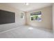 Bright bedroom with large window and neutral walls at 9636 W 71St Pl, Arvada, CO 80004