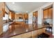 Spacious kitchen featuring stainless steel appliances, granite countertops, and breakfast bar seating at 9636 W 71St Pl, Arvada, CO 80004