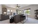 Open-concept living room featuring a fireplace, shelving, and neutral decor at 9636 W 71St Pl, Arvada, CO 80004