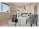 Large main bedroom with tray ceiling, ceiling fan, sitting area and bright natural light at 9636 W 71St Pl, Arvada, CO 80004