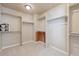 Spacious walk-in closet with installed shelving, rods, and carpet at 9636 W 71St Pl, Arvada, CO 80004