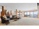 Spacious basement area with large windows overlooking the pool and access to a staircase at 2505 Big Bear Cir, Sedalia, CO 80135