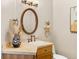 Charming powder room with a decorative mirror, stylish vanity, and elegant fixtures at 2505 Big Bear Cir, Sedalia, CO 80135