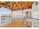 Spacious interior boasts exposed wooden beams, railing, and hardwood floors with incredible natural light at 2505 Big Bear Cir, Sedalia, CO 80135