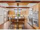 Spacious kitchen with wood cabinets, stainless steel appliances, and a large island with barstool seating at 2505 Big Bear Cir, Sedalia, CO 80135