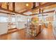 Open kitchen and dining area featuring a large island with seating and stainless steel appliances at 2505 Big Bear Cir, Sedalia, CO 80135