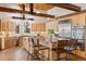Spacious kitchen with wood cabinets, stainless steel appliances, and a large island with barstool seating at 2505 Big Bear Cir, Sedalia, CO 80135