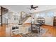 Open-concept living room with a spiral staircase, hardwood floors, and natural light at 2505 Big Bear Cir, Sedalia, CO 80135