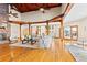 Bright living room featuring vaulted wood ceilings, wood beams, hardwood floors, and a large view window at 2505 Big Bear Cir, Sedalia, CO 80135