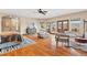 Spacious main bedroom featuring hardwood floors, a ceiling fan, and balcony access through French doors at 2505 Big Bear Cir, Sedalia, CO 80135