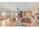 Bright main bedroom with a fireplace, hardwood floors, outdoor access, and comfortable seating at 2505 Big Bear Cir, Sedalia, CO 80135