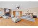 Open main bedroom featuring a brick fireplace, hardwood floors, and cozy seating area at 2505 Big Bear Cir, Sedalia, CO 80135