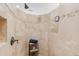 Luxurious tile shower with a rainfall showerhead and built-in shelving at 2505 Big Bear Cir, Sedalia, CO 80135